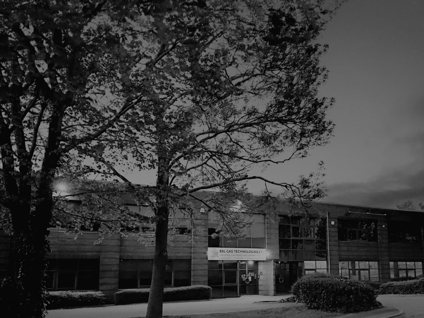 BSL building outside at night header black & white